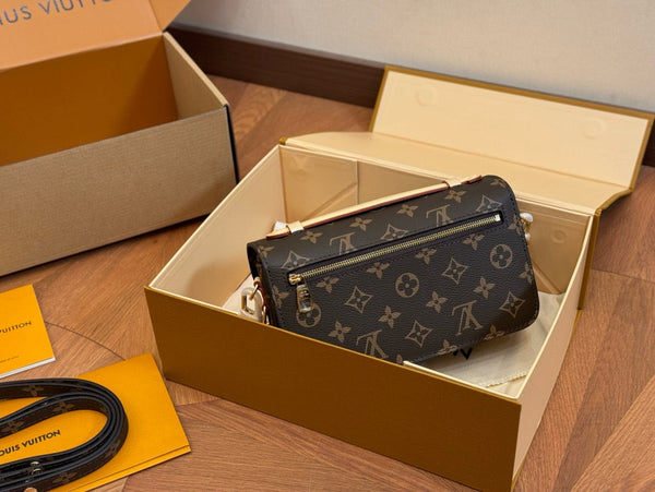 Louis Vuitton sling side handbag